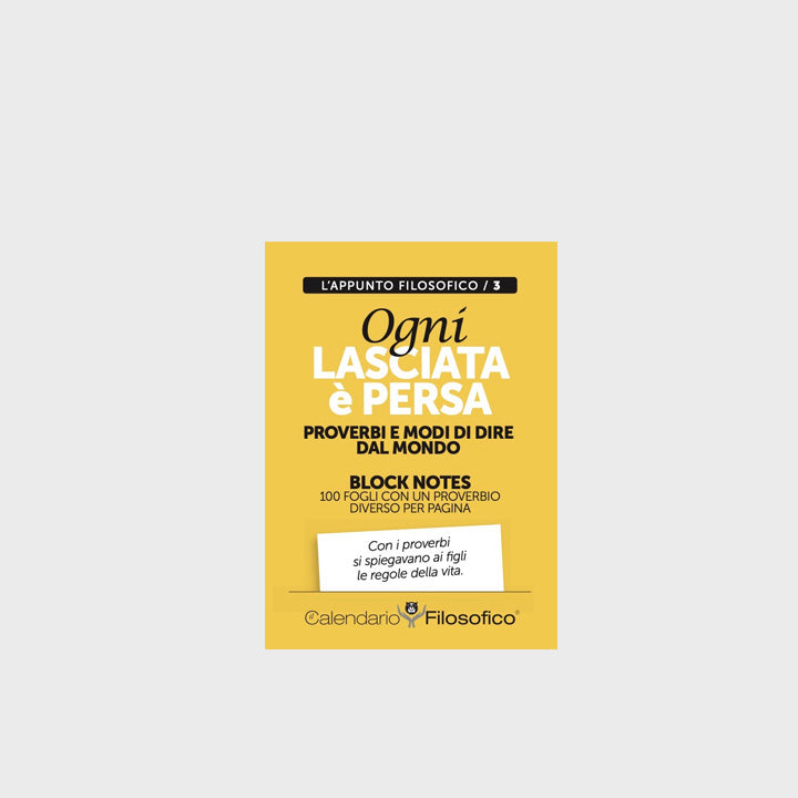 Block notes con frasi ispirazionali, copertina gialla con proverbio “Ogni lasciata è persa”. 100 fogli quadrettati.